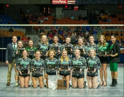 Pictured is the Musselman High Schools Varsity Volleyball team winning at states for the third year in a row. 