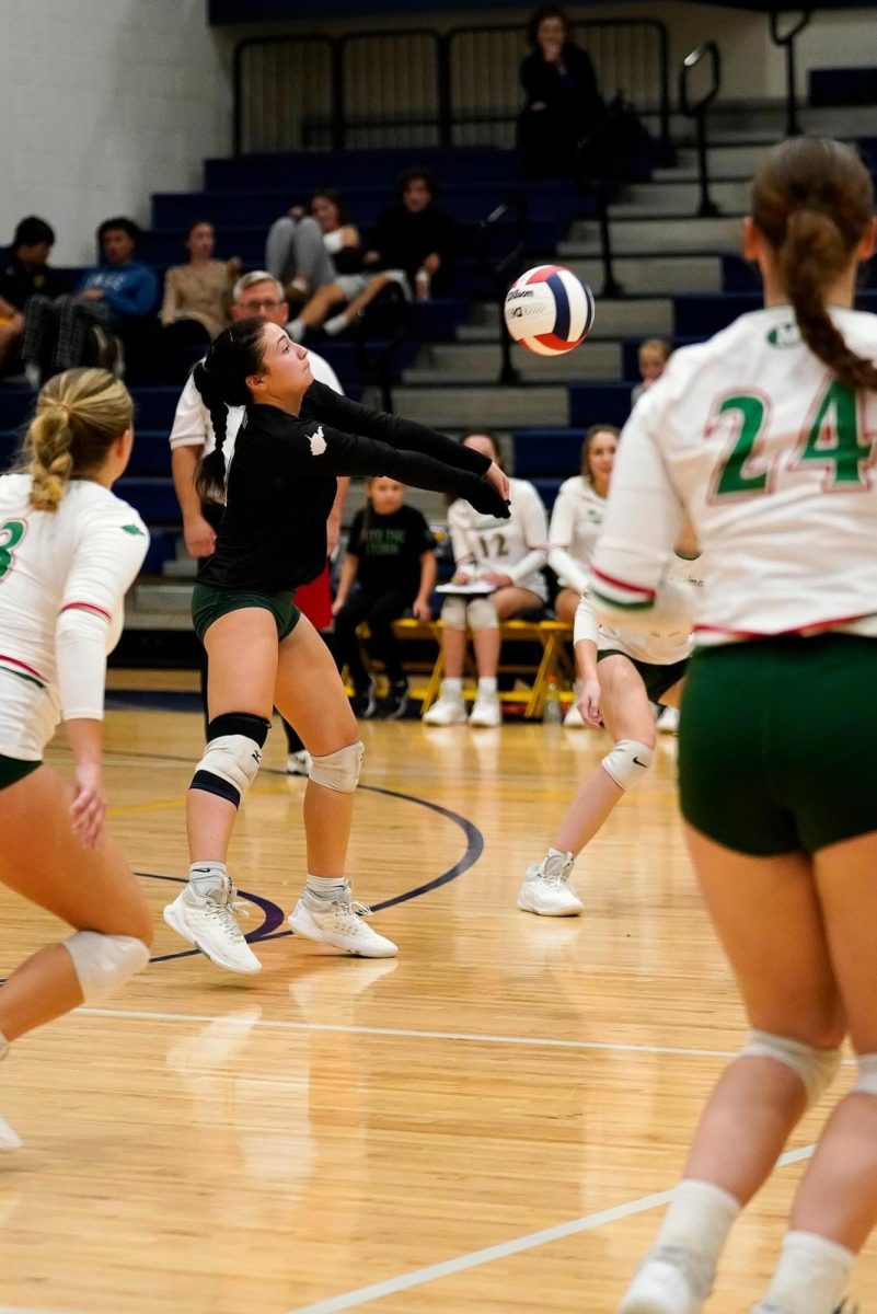 Ava Dunniagn, center, competes against Hedgesville.