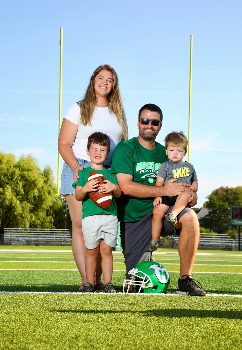 Coach Smith pictured with his wife and two sons.
Picture provided by Coach Smith