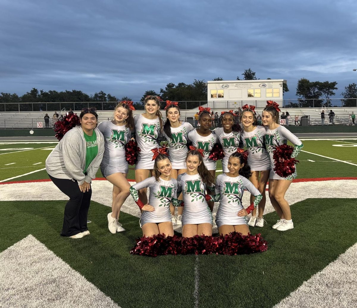 Pictured above, Junior varsity coach Kayla with jv cheer team.