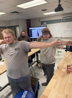 Pictured above are archery club  students learning the basics of using how to hold a bow. 
